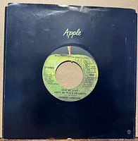 Record in black Apple sleeve, full view