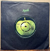 7" single in black Apple company sleeve, label visible through center