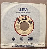 Record in WEA sleeve front view