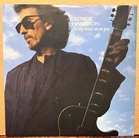 Front of picture sleeve with George Harrison and guitar