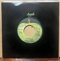 Front of 7-inch single in Apple company sleeve showing A-side label details