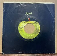 Record in black Apple sleeve, front view
