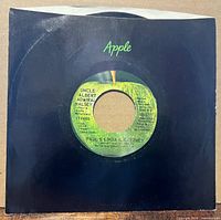 45 rpm single in black Apple sleeve showing A-side label