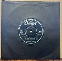 Front of 7-inch single in black sleeve showing A-side label The Back Seat Of My Car