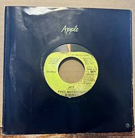 Front view record in black Apple sleeve showing A-side label Jet