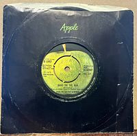 Front of 7-inch single in black Apple sleeve