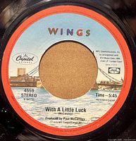 Label side showing "With A Little Luck", Capitol 4559 skyline label