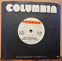 Front of record in black Columbia sleeve, showing A-side label with track details