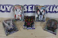 Group shot of five packaged 1/32 mini 4WD cars