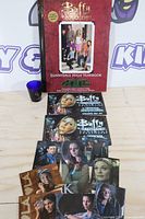 Full lot showing yearbook, shot glass, loose and packaged photocards