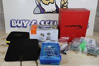 Group shot of all items: speaker box, antenna, Pi kit case, HyperX box, zippered tester case, component bags