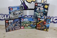 Group shot of five sealed LEGO Star Wars set boxes