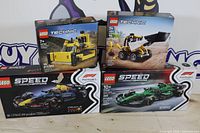 Front view of four LEGO set boxes