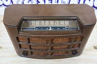 Front top view showing full radio, dial, grille, knobs