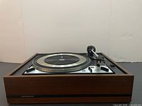 Front view of Dual 1218 turntable in Norseco plinth