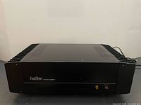 Front view of Hafler DH-200 amplifier showing logo and power switch