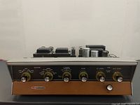 Front view showing faceplate, knobs, toggles