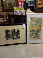Both framed lithographs side by side