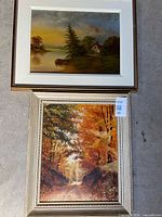 Both framed landscape paintings