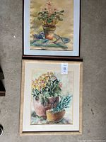 Both framed watercolor paintings side by side showing overall condition and frames