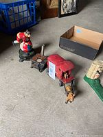All four cast iron replicas grouped on floor