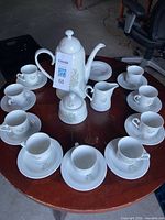 Full tea service laid out showing pattern and piece count