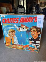 Front of Chutes Away!! box showing title graphics