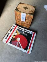Closed chest beside boxed table tennis set