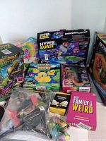 Group shot showing majority of boxed toys and loose bags