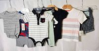All seven clothing items hung for overview