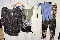 Group view of six garments on hangers