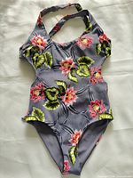 Front view of grey floral one-piece swimsuit