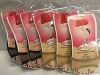 Six retail packages of foot nursing pads displayed front view