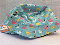 Exterior view of patterned bucket hat with tag