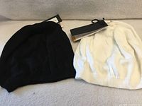 black and white Parkhurst beanies side by side