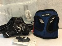 Both harnesses with packaging and accessory bag