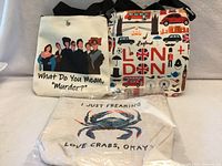 Group shot of two crossbody purses and one zippered pouch