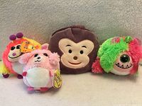 Four items: two Monstaz clips, Beanie Ballz bear clip, monkey coin purse