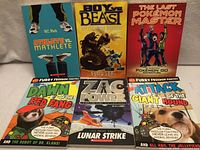 Front covers of all six books displayed