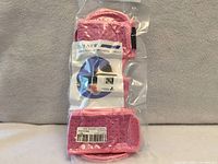 Front of sealed package showing pink plantar fasciitis night splint
