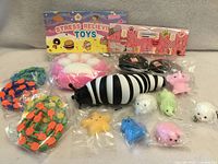 Group shot of all squishy and fidget toys in packaging