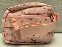 Overall view of the pink unicorn-print purse showing zipper, strap and buckle