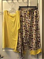 Full set hanging: yellow top, printed capri pants, matching bag