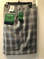Front view of Haggar C18 grey and white plaid shorts with tags