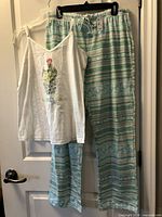 Full view of tank top and pants on hanger