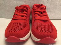 front view of both red running shoes