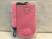 Front view of pink water bottle carrier with strap in clear case
