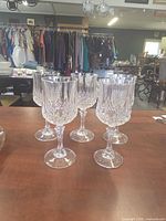 Front angled view of all five crystal wine glasses on tabletop