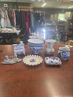 Group shot of all porcelain, milk glass, and silver pieces