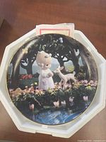 Front view of decorative plate in Styrofoam packaging